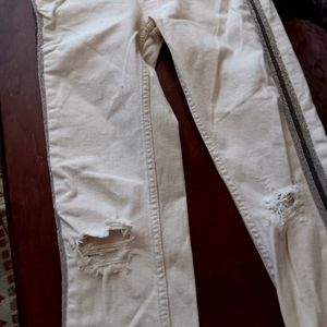 Free people jeans with a racing stripe down the side